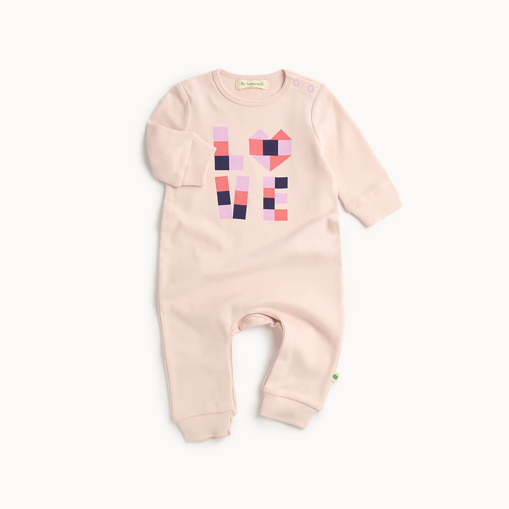 Pink cotton baby playsuit with geometric heart design 