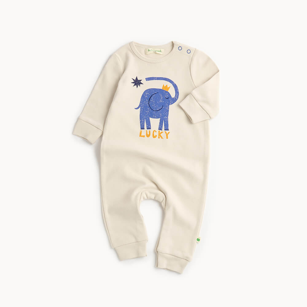 White cotton baby playsuit with blue elephant design and 'Lucky' text 