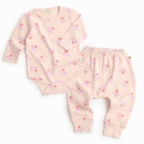 Baby outfit set with cotton pink long-sleeve bodysuit and matching leggings 