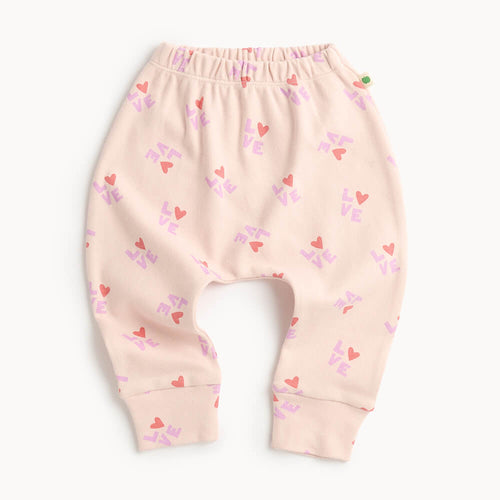 Pink cotton baby and kid pants with heart patterns on 