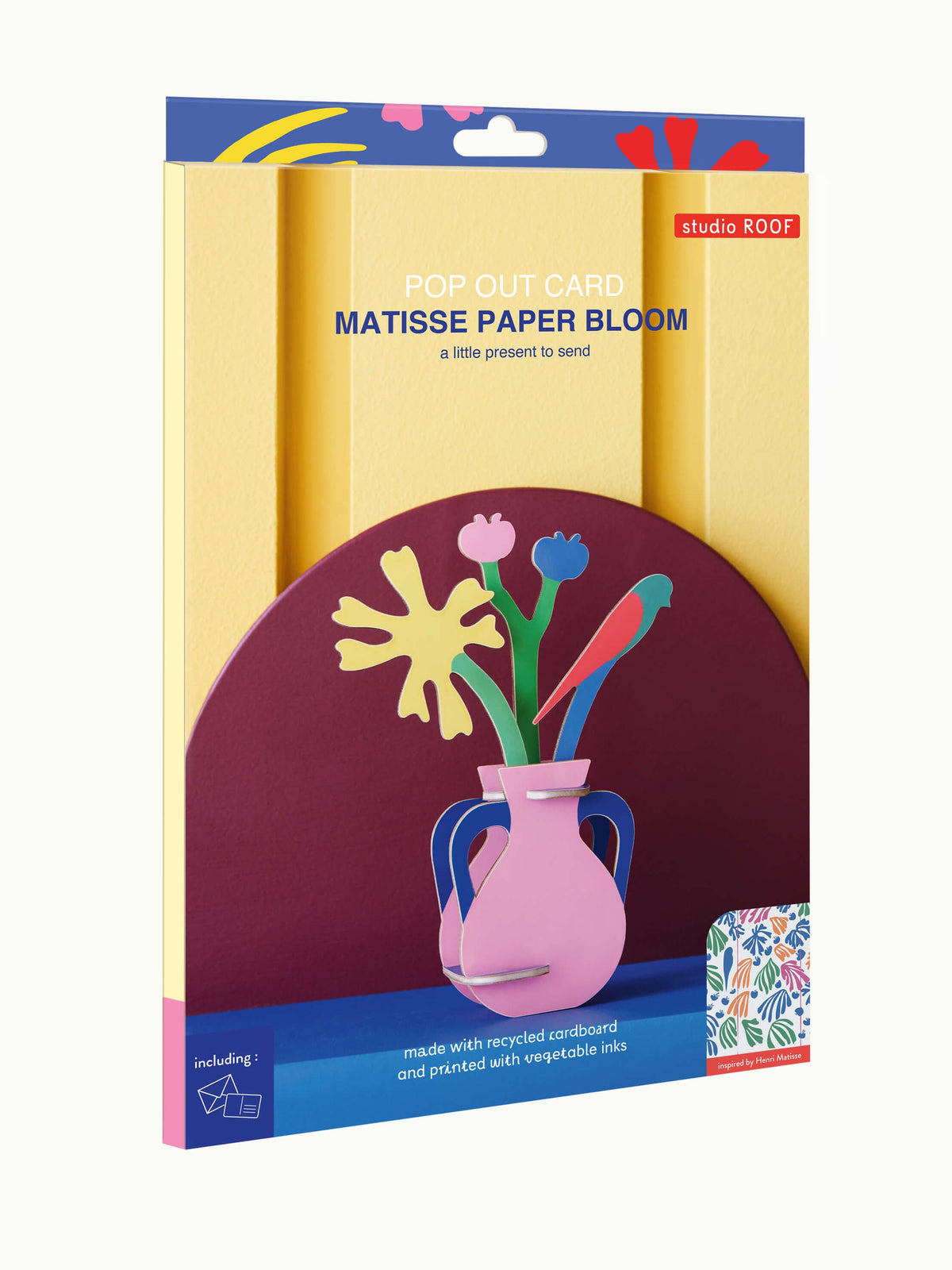 A boxed craft paper set labeled 'POP OUT CARD MATISSE PAPER BLOOM' with a colorful front illustration of a pink vase holding yellow, blue, and red flower shapes, shown on a plain light background.