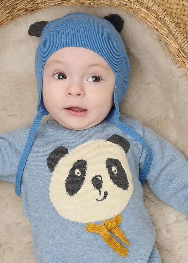 Baby wearing a blue panda-themed outfit with a hat